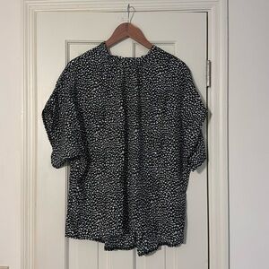Black and white animal print blouse. Loose fit. Size Large.